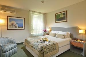 Postel nebo postele na pokoji v ubytování Hotel Eurotel El Bosque + 31 fotografií
