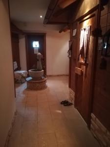 a hallway with a bathroom with a sink in a room at Apartment Christopherhof 56 Grafenwiesen in Grafenwiesen