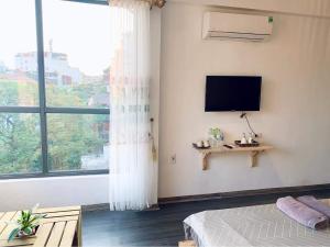 TV a/nebo společenská místnost v ubytování Sunny Hanoi Homestay