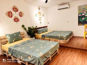 Postel nebo postele na pokoji v ubytování Sunny Hanoi Homestay