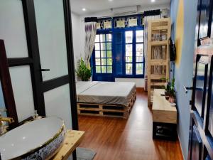 Postel nebo postele na pokoji v ubytování Sunny Hanoi Homestay