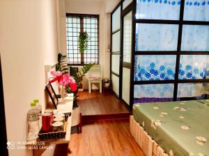Postel nebo postele na pokoji v ubytování Sunny Hanoi Homestay