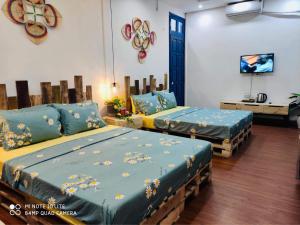 Postel nebo postele na pokoji v ubytování Sunny Hanoi Homestay