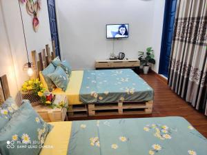Postel nebo postele na pokoji v ubytování Sunny Hanoi Homestay