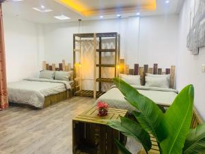 Postel nebo postele na pokoji v ubytování Sunny Hanoi Homestay