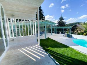 an exterior view of a house with a swimming pool at Space Place in Yablunytsya