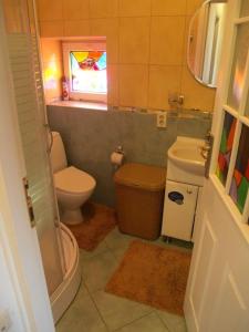 a bathroom with a toilet and a sink at Дом для большой и дружной семьи in Bishkek