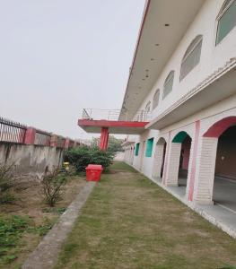 an empty hallway of a building with a yard at Jiya Green Garden & Banquet, Sonipat in Sonīpat