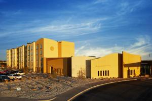 a building in a parking lot next to a building at Zia Park Casino, Hotel, & Racetrack in Hobbs