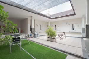 an open living room with a large skylight at Koolkost near Stikes Cirebon in Cirebon