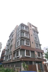 a tall apartment building in a city at NK7 AL Newtown in Kolkata