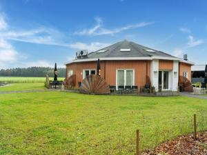 a house with a large yard in front of it at Pleasant holiday home in Goirle with sauna in Goirle