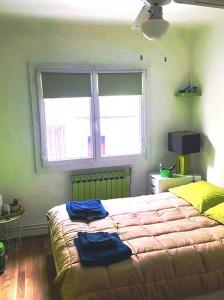 a bedroom with a large bed and a window at Le Passe-Port pour Marseille in Marseille