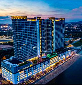 a night view of a large building with lights at SwissBelResidence Studio With King Bed in Kuantan