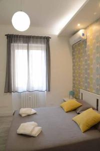 A bed or beds in a room at Casa e Appartamenti per Vacanze Jenner