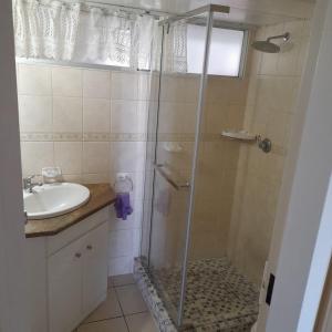 a bathroom with a shower and a sink at 102 Santana Holiday Resort in Margate