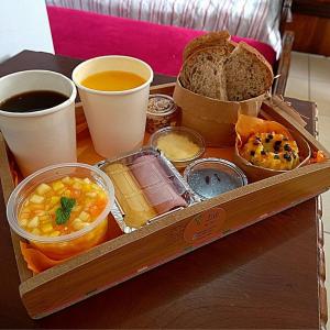 a tray filled with different types of food on a table at Pousart - Floripa in Florianópolis