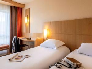 Letto o letti in una camera di ibis Antwerpen Centrum