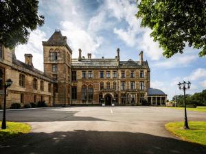 a large brick building with a large driveway at Walton Hall Hotel & Spa by Sunday in Wellesbourne Hastings