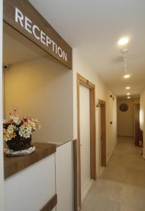 a reception room with a sign that reads reception at Marinda Otel in Cesme