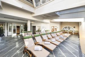 a row of chairs in a waiting room at Ferien & Wellnesshotel Windschar in Brunico