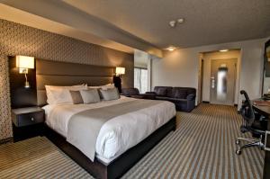 Кровать или кровати в номере Hôtel Nouvelle-Frontière