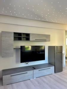a living room with a large flat screen tv at Melissa in Belluno