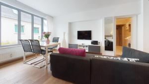 a living room with a couch and a table at Ankerhaus Ankerhaus 2 in Hörnum