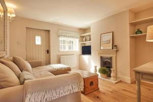 a living room with a couch and a fireplace at 21 Pound Street in Petworth