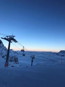 a ski lift in the snow at dusk at Bärghuis Jochpass - Alpine Hideaway - 2222müM in Engelberg
