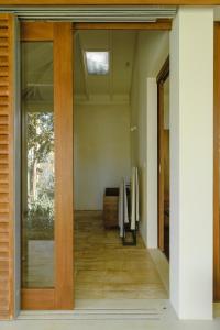 a pivot door in a house with a hallway at Kurulu Bay in Ahangama
