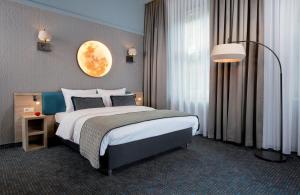 Posteľ alebo postele v izbe v ubytovaní Leonardo Boutique Hotel Krakow Old Town