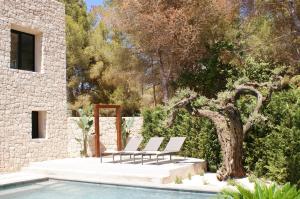 A garden outside Extravagant Ibiza Villa Casa Tranquila Sargamassa 5 Bedrooms Fantastic Sea Views Private Pool Santa Eulalia