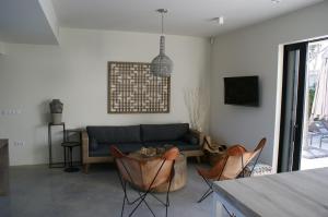 A television and/or entertainment centre at Extravagant Ibiza Villa Casa Tranquila Sargamassa 5 Bedrooms Fantastic Sea Views Private Pool Santa Eulalia