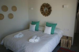 A bed or beds in a room at Extravagant Ibiza Villa Casa Tranquila Sargamassa 5 Bedrooms Fantastic Sea Views Private Pool Santa Eulalia