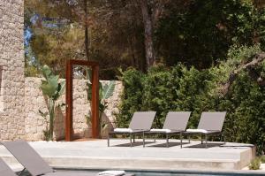 A garden outside Extravagant Ibiza Villa Casa Tranquila Sargamassa 5 Bedrooms Fantastic Sea Views Private Pool Santa Eulalia
