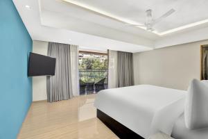 Postel nebo postele na pokoji v ubytování Radisson Resort Goa Baga + 21 fotografií