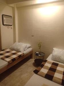 Postel nebo postele na pokoji v ubytování Antelmi Travelers Inn