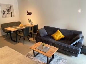 a living room with a couch and a table at Apartment Lucie in Plomin