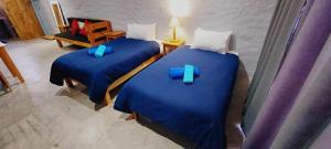 Un pat sau paturi într-o cameră la Swartberg Cottages