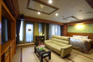 a living room with a couch and a television at Hotel Water Gate Nagoya - Love Hotel for couple - in Nagoya