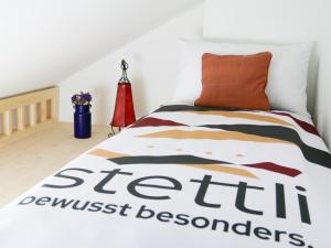 Postel nebo postele na pokoji v ubytování stettli resort