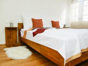 Postel nebo postele na pokoji v ubytování stettli resort