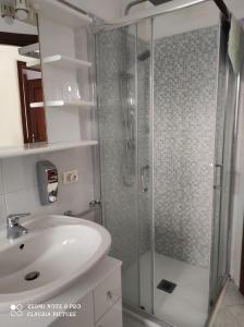 a bathroom with a shower and a sink at Casa Giò in Assemini