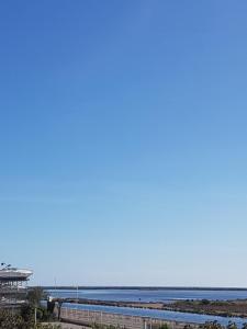 a view of the ocean from the beach at studio gruissan proche plage des chalets in Gruissan