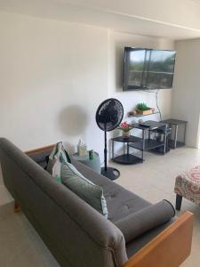 a living room with a couch and a table at Ocean and Mountain View Condo - Free Reserved Parking in Honolulu