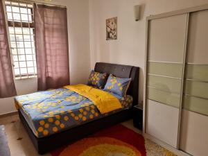 Postel nebo postele na pokoji v ubytování Homestay Haizal Dataran Segar Haizal Guest House