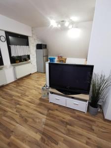 a living room with a large flat screen tv at 2,5 Zimmer Wohnung Hennef Nähe Siebengebirge in Uckerath