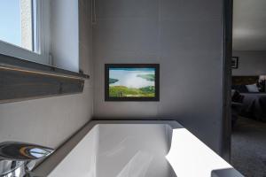 a kitchen with a sink and a picture on the wall at Oak Tree Inn in Balmaha