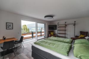 Postel nebo postele na pokoji v ubytování Seeblick Homes